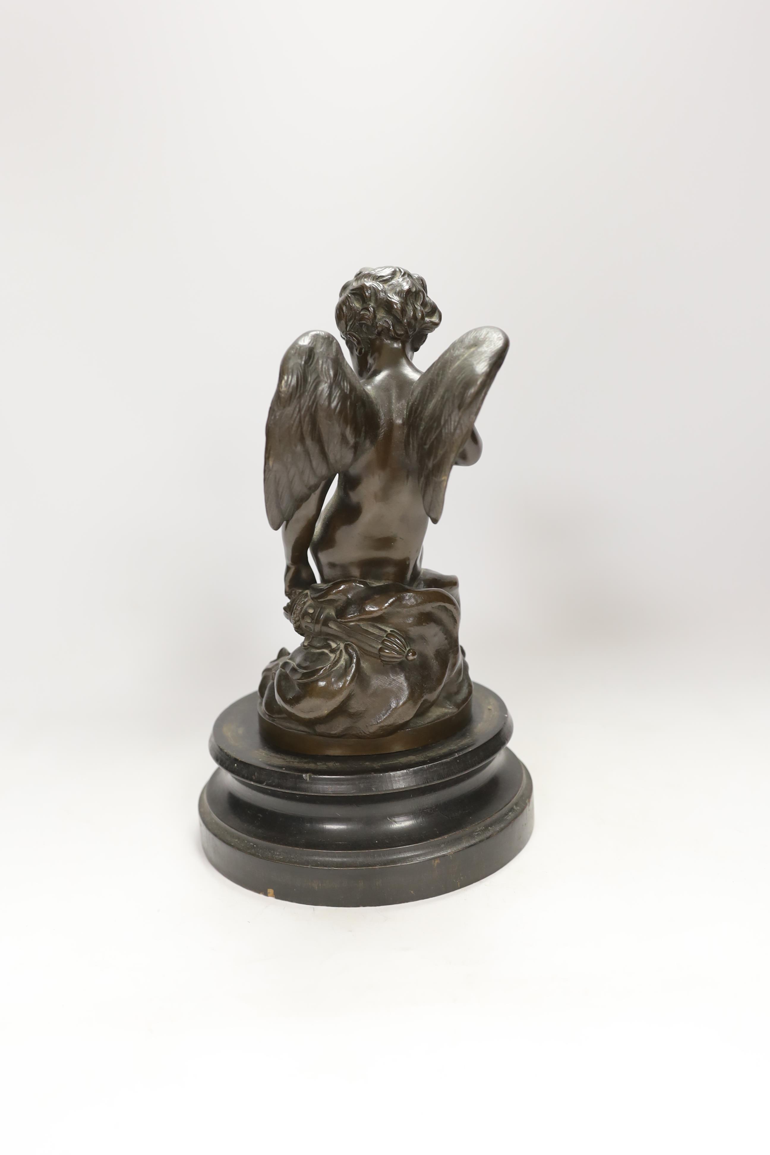 After Etienne Maurice Falconet (French, 1716-1791), a cast bronze of Cupid ‘L’Amour Menacant, on hardwood stand, 28cm total